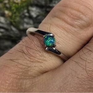 The “you’re my world” Sterling silver black opal ring